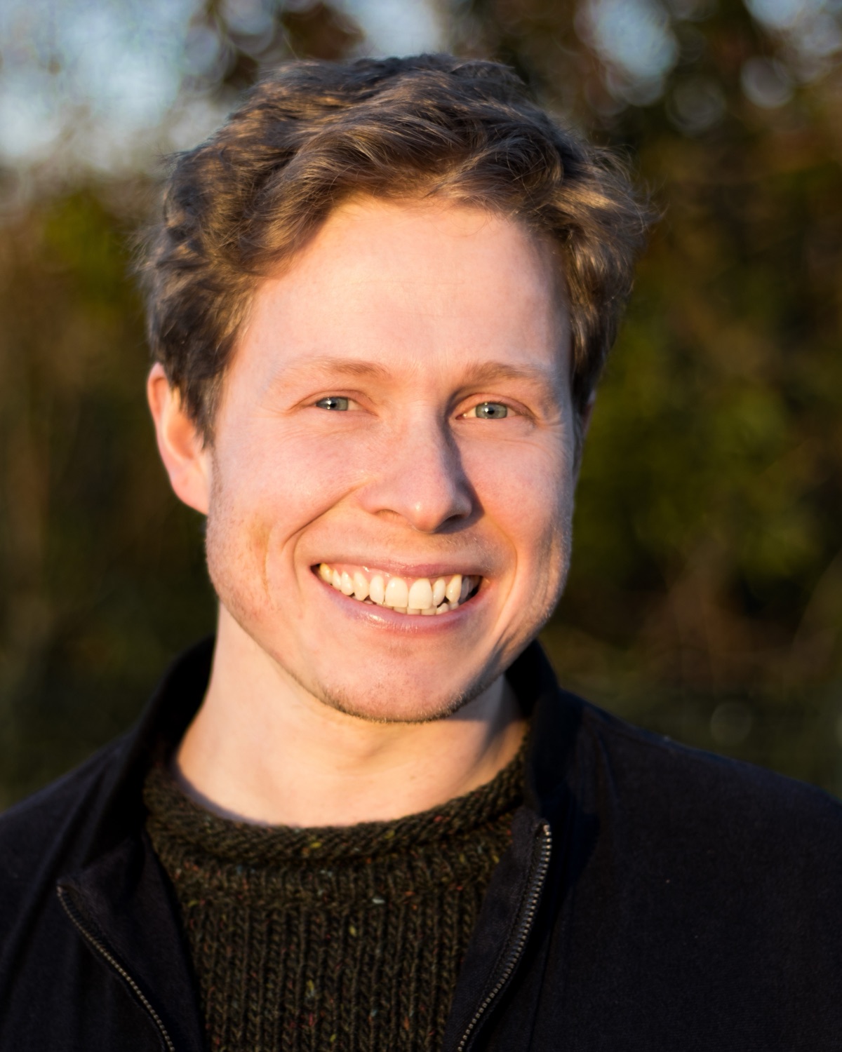 Philip Marken — smiling, outdoors in low evening light